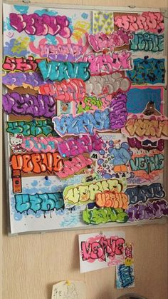 a bulletin board covered in lots of colorful graffiti