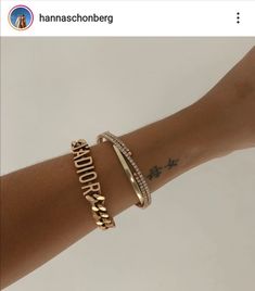 a woman's arm with two bracelets on it and the word hope written in gold