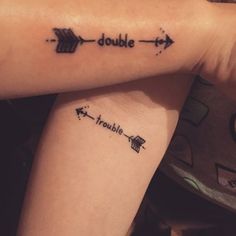 two people with tattoos on their arms that say double arrow and one has the word trouble