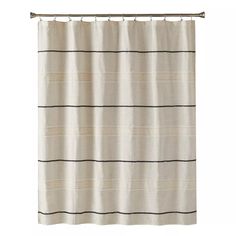 a white shower curtain with black stripes on the bottom and bottom, hanging from a metal rod