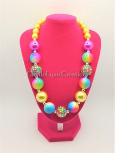 -  Pink, blue and yellow and silver spacers.  So pretty.   -  Your little girl or toddler will look like a Princess in this beautiful, fun, Chunky Bubblegum Necklace. -  This necklace would be the perfect dazzling addition for your little Princess outfit to wear for any special occasion. -  Necklace length 17"  20mm & 12mm beads Materials:  acrylic beads, resin beads, bead wire, crimp tubes, jump rings, stainless steel clasps **Custom Orders Are Welcome** Ready to ship in 1 to 3 business days by USPS First Class Mail. - Returns & Exchanges I do accept returns and exchanges.  Just mail it back to me within 7 days of delivery. WARNING The jewelry is made with small beads and small parts.   Please do not leave your child unattended while wearing the jewelry.  By purchasing the jewelry you are Toddler Necklace, Toddler Jewelry, Princess Outfit, Jewelry Chunky, Bead Wire, Bubblegum Necklace, Small Beads, Princess Outfits, Beaded Material