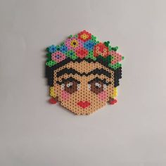 a beaded fridace with a woman's face on it