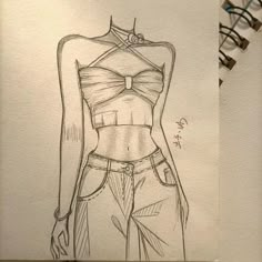 a drawing of a woman's top and pants with an arrow on the back