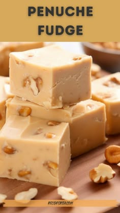 several pieces of fudge stacked on top of each other with nuts in the background