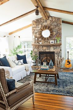 a living room filled with furniture and a fire place