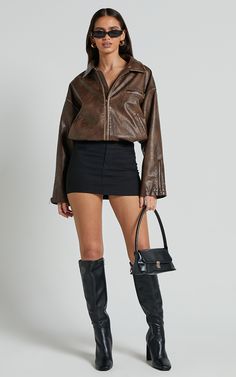 Get ready to turn heads in the Sophia Jacket - Crop Pu Bomber Jacket in Brown. This trendy piece is perfect for adding some edge to any casual outfit. Made from high-quality polyurethane, this jacket features a crop length and long sleeves, making it ideal for cooler weather. The rich brown color adds warmth and sophistication to your look, while the bomber style gives off an effortlessly cool vibe. Pair it with jeans and a t-shirt for an effortlessly chic ensemble or dress it up with a skirt and heels for a night out on the town. Whether you're hitting the streets or heading out on the town, this jacket will keep you looking stylish all day long.Product Details:Zips detailInner liningPU fabricCasual useCrop lengthLong sleevePolyurethane materialMaterial and Care100% PolyurethaneLow / No s Jacket Crop, Mum Jeans, Cropped Jackets, Red Sequin Dress, Basic Black Dress, Neon Outfits, Bachelorette Dress, Spring Maxi Dress, Nashville Outfits