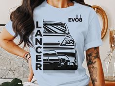 Top offer of the season! Vintage Car Lancer EVO8 Graphic Tee, Classic Car Enthusiast T-Shirt, Black and White Car Illustration, Automotive Apparel, Unisex Fit, now at an exclusive price of $19.98
#BlackWhiteCar #CarEnthusiastGift #ClassicCarTShirt #RetroCarDesign #RacingCarShirt #AutomotiveApparel #VintageCarTee #LancerEvo8Shirt #UnisexTShirt #GraphicTee Black And White Car, Cars Tees, Car Shirts, White Car, Car Illustration, Clothing Designs