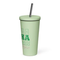 a green cup with a straw in it and the words haha written on it