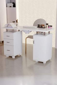 Description: Attract more customers with this functional manicure table. Its professional profile fits right in your high-end salon. The classy white finish is covered on the sturdy wooden structure. Given the experience of the customers, we designed a thick padded cushion on the tabletop, where your customers can rest their wrists while having nails done. Features: A nail table with good quality, promises a long life span Meticulously made, the surface is smooth and sleek 3 drawers and 1 cabine Nail Table Designs, Funky Nail Salon Decor, Nail Table Organization, Home Nail Salon Ideas Small Spaces Interior Design, Nails Table Ideas Salons, Mesa Nail Designer, Small Nail Room, Nail Station Ideas Small Spaces, Nails Salon Design Ideas