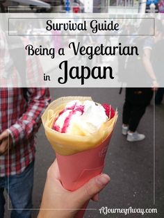 a person holding an ice cream cone with the words survival guide being a vegetarian in japan