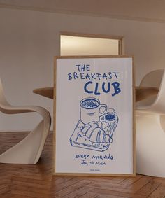 the breakfast club sign is next to a chair