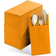 a stack of orange napkins with silverware on top and forks in the pocket