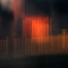 blurry photograph of an orange and black building