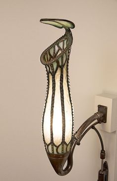 a lamp hanging from the side of a wall