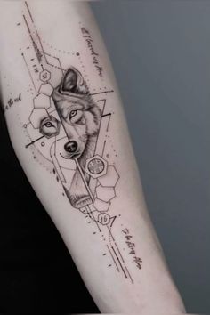 a woman's arm with a wolf and geometric shapes on the left side of her arm