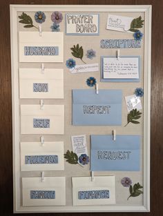 a bulletin board with flowers, notes and magnets attached to it's sides