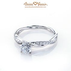 a white gold ring with diamonds on it