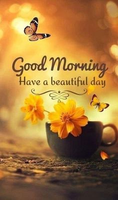 a coffee cup with yellow flowers in it and the words good morning have a beautiful day