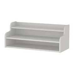 a white shelf with two shelves on one side and an empty shelf on the other