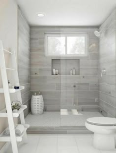 a white toilet sitting in a bathroom next to a shower and shelf filled with items