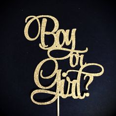 a cake topper that says boy or girl on it