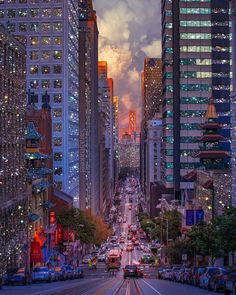 a city street filled with lots of traffic and tall buildings at sunset or dawn in the distance