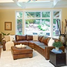 a living room filled with furniture and a large window