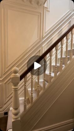 an image of a staircase with white railings and wood balconies on it