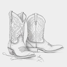 a pair of cowboy boots sitting on top of a table