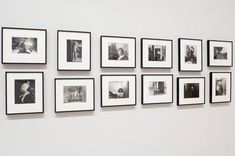 black and white photographs hanging on the wall