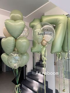 balloons and streamers in the shape of hearts on stairs