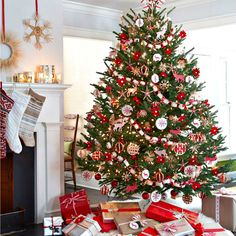 a decorated christmas tree with presents under it