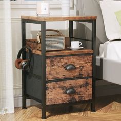 a nightstand with two drawers and a basket on top