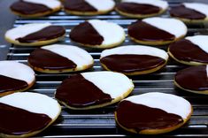 chocolate and white cookies are cooling on the grill