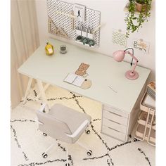 a white desk with drawers and a chair next to it on a carpeted floor