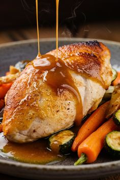 Roast chicken breast topped with gravy served with carrots and zucchini.