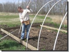 a man standing in the middle of a garden