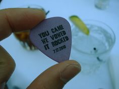 someone is holding up a guitar pick that says you came we loved it rocked