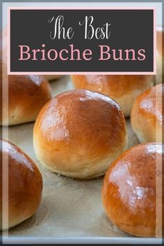 the best brioche buns on a baking sheet with text overlay that reads, the best brioche buns