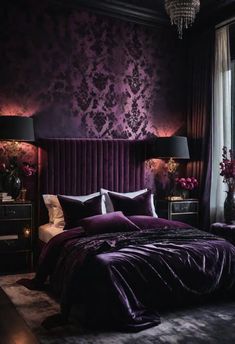 a bed with purple sheets and pillows in front of a wallpapered bedroom window