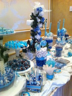 a table with blue and white desserts on it