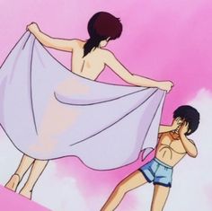 two people in bathing suits and one is holding a towel