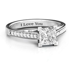 a princess cut diamond ring with the words i love you written on it's side