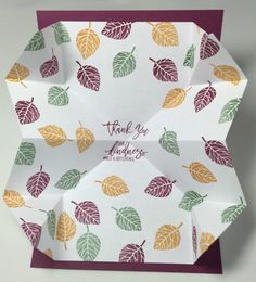 an origami folded thank you card with leaves on it