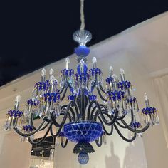 a blue chandelier hanging from the ceiling