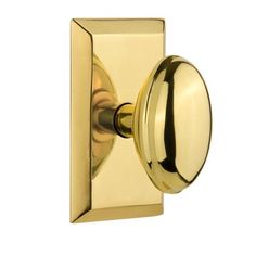 an image of a brass door handle on a white background