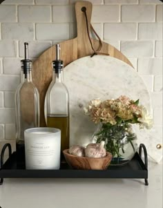 bottles and vases are sitting on a shelf