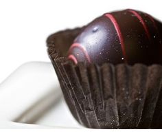 a close up of a chocolate ball on a plate