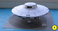 a model of a flying saucer sitting on top of a table