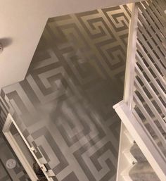 an overhead view of a bathroom with gray and white wallpaper